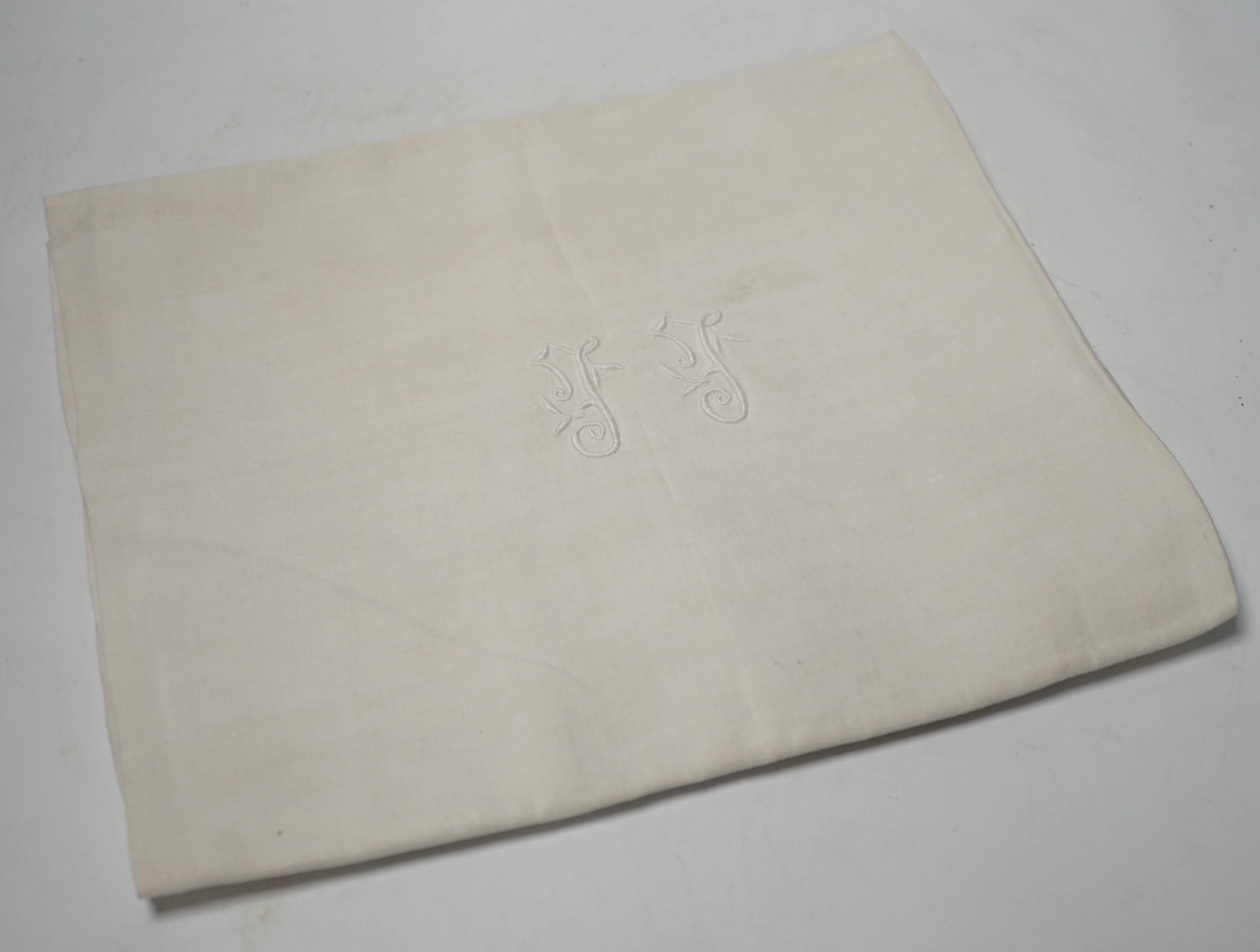 A French monogrammed linen refectory tablecloth and twelve matching dinner size napkins